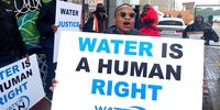 A member of the Water Crisis Committee sings in protest over water cuts in and around Johannesburg, outside the Brixton Multi-Purpose Centre. (Photo: Naledi Sikhakhane)