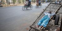 A man takes a short nap on a push cart during a hot day in Dhaka, Bangladesh, 26 April 2024. According to the Bangladesh Meteorological Department (BMD), the duration of the heat wave has been extended on 25 April for the next 72 hours.  EPA-EFE/MONIRUL ALAM