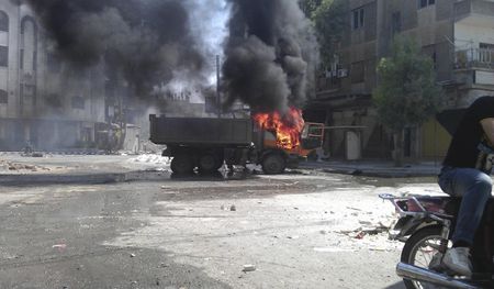 Syria says it could use chemical arms against foreign intervention