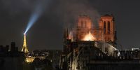 Smoke and flames rise from Notre-Dame Cathedral on April 15, 2019 in Paris, France. A fire broke out on Monday afternoon and quickly spread across the building, collapsing the spire. The cause is yet unknown but officials said it was possibly linked to ongoing renovation work. (Photo by Veronique de Viguerie/Getty Images)