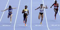Shelly-Ann Fraser-Pryce of Jamaica competes in heat 8 of the Women 100m Round 1 heats in the Athletics competitions in the Paris 2024 Olympic Games, at the Stade de France stadium in Saint Denis, France, 02 August 2024.  EPA-EFE/RONALD WITTEK