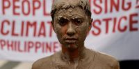 A protester covered in mud takes part in a demonstration in commemoration of Super Typhoon Haiyan's 10th year anniversary in Manila, Philippines, 08 November 2023. Protesters called for justice for the victims of Super Typhoon Haiyan and to amplify the urgency of climate solutions around the globe. Haiyan (local name Yolanda) is one of the most powerful tropical cyclones ever recorded which brought havoc killing thousands when it hit the central Philippines on 08 November 2013.  EPA-EFE/FRANCIS R. MALASIG