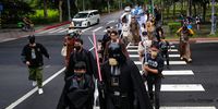 epa09925753 Star Wars fans parade at the street during the Star Wars day celebration in Taipei, Taiwan, 04 May 2022. Star Wars Day is celebrated every 04 May by many fans in different parts of the world.  EPA-EFE/RITCHIE B. TONGO