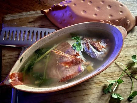 Red Roman poached in a clay pot