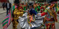 Members of a traditional Bolivian dance group perform during a pre-carnival parade prior to the Jisk'a Anata Carnival, in the streets of La Paz, Bolivia, 28 January 2024. The Jisk'a Anata pre-Carnival is a colorful celebration full of harlequins and cholitas that takes place before the February Carnival.  EPA-EFE/Esteban Biba  AUSTRALIA AND NEW ZEALAND OUT