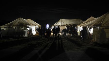 Hopeful voters brave long queues to cast ballots in crucial poll