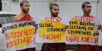 Sri Lankan university students and civil rights activists hold placards and shout slogans in front of the Bangladesh High Commission during a protest in solidarity with the students of Bangladesh, in Colombo, Sri Lanka, 22 July 2024. They demand an immediate end to the Bangladeshi government's alleged repression of students protesting the job quota system. On 22 July Bangladesh was under curfew; widespread disruption of telecoms prevailed a day after the Bangladesh Supreme Court scrapped some quotas for government jobs that sparked protests, and police were authorized to enforce 'shoot on sight' orders across the country during curfew as casualties mounted and law enforcement struggled to contain the unrest. The Bangladeshi government imposed a nationwide curfew and deployed military forces after violence broke out in Dhaka and other regions following student-led protests demanding reforms to the government's job quota system.  EPA-EFE/CHAMILA KARUNARATHNE