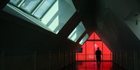 A man walks through the atrium of one of two buildings on Fallaize Street in the new Oxford North district ahead of it's opening on September 30, 2025 in Oxford, England. Oxford North is the £1.2 billion, 1 million sq ft flagship innovation district that has been purposely designed as a future UK economy powerhouse to host the next generation of local, domestic and international science and technology companies. (Photo by Leon Neal/Getty Images)