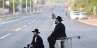 Ultra-Orthodox Jews block the main highway in Bnei Brak while protesting against the army recruitment law in Jerusalem, 19 August 2025. In June 2024, the Israeli Supreme Court ruled unanimously that the state of Israel should recruit ultra-Orthodox Jews into the army.  EPA/ABIR SULTAN