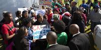 Minister of Women Bathabile Dlamini and Minister of Rural Development and Land Reform, Maite Nkoana-Mashabane, meet protesters outside the hall where President Cyril Ramaphosa gave his official Women's Day address in Paarl. The President's address was disrupted by protesters who called for him to sign a moratorium on farm evictions. 9 August 2018. Photo: Leila Dougan