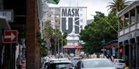 CAPE TOWN, SOUTH AFRICA - NOVEMBER 29: A sign in Long Street urges the public to mask up on November 29, 2021 in Cape Town, South Africa. The National Institute for Communicable Diseases (NICD) confirmed that the new COVID-19 variant (Omicron) has been detected in South Africa. (Photo by Gallo Images/ER Lombard)
