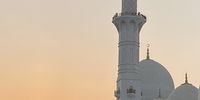 Sunset at The Grand Mosque, Al Madinah Al Riyadiyah, Abu Dhabi, UAE. Photographer: Shalendra Misser