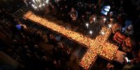 Bulgarian Orthodox faithfuls light candles attached to jars of honey during a holy mass for the 'sanctification of honey' at the Presentation of the Blessed Virgin Church in the town of Blagoevgrad, Bulgaria, 10 February 2025. Honey and beehives are sanctified by performing rituals for health and prosperity. On St. Haralambos' Day, who according to tradition is the lord of all illnesses, sick or blind people go to church and pray for healing. Housework is strictly forbidden on that day over fears of any illness, with women being only allowed to bake traditional bread for the occasion. The honey is then consecrated at the local church and then all the bread is coated with that honey. The rest of it will be kept as a remedy at home.  EPA-EFE/VASSIL DONEV
