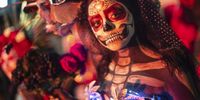 A person dressed in a costume participates in the catrinas procession as part of the celebrations for the Day of the Dead, in Mexico City, Mexico, 22 October 2023. Tens of thousands of Mexicans and tourists observed the 'Mega Procession of the Catrinas,' a lively parade of skeletons in Mexico City. This event serves as a prelude to the Day of the Dead.  EPA-EFE/Isaac Esquivel