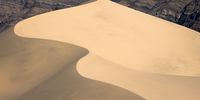 A snaking dune in Death Valley meets the saddle of the surrounding mountains.© Patrick Mueller, United States of America, Winner, National Awards, 2021 Sony World Photography Awards
