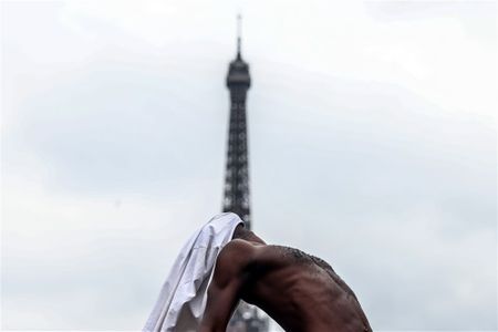 The Day in Pictures: A rally in support of French detainees in Iran, and the 75th Death Anniversary of Mahatma Gandhi