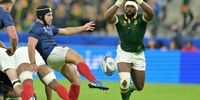 Springboks captain Siya Kolisi (right) attempting to block a kick Antoine Dupont of France action during their Rugby World Cup Quarter Final match. (Photo: Lionel Hahn/Getty Images)