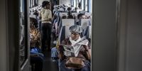 A passenger reads a newspaper aboard a Kenya Railways Corp. train journey on the Mombasa-Nairobi Standard Gauge Railway (SGR) line in Kenya. China's modern-day adaptation of the Silk Road, known as the Belt and Road Initiative, aims to revive and extend trading routes connecting China with Central Asia, the Middle East, Africa and Europe via networks of upgraded or new railways, ports, pipelines, power grids and highways. (Photo: Luis Tato/Bloomberg via Getty Images)
