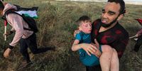 A Palestinian carries a wounded boy after Israeli troops opened fire during clashes at a march against Israeli 'Flag March' in the east of Gaza Strip, near the border with Israel, 18 May 2023. Palestinians organized their own ‘Flag March’ as a protest against Israeli right-wing 'Flag March' held in Jerusalem marking Jerusalem Day. Israeli celebration of Jerusalem Day has long been viewed by Palestinians as a provocation.  EPA-EFE/MOHAMMED SABER