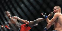  Israel Adesanya of Nigeria kicks  Sean Strickland of United States  during the UFC 293 event  at Qudos Bank Arena on September 10, 2023 in Sydney, Australia. (Photo by Mark Evans/Getty Images)