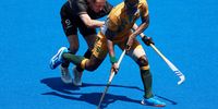 TOKYO, JAPAN - JULY 29: Nduduza Peabo Lembethe of Team South Africa moves the ball past Niklas Wellen of Team Germany during the Men's Preliminary Pool B match between South Africa and Germany on day six of the Tokyo 2020 Olympic Games at Oi Hockey Stadium on July 29, 2021 in Tokyo, Japan. (Photo by Buda Mendes/Getty Images)