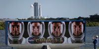 (L-R) NASA astronauts Raja Chari, Kayla Barron, Tom Marshburn, and European Space Agency astronaut Matthias Maurer, of Germany on a sign near the SpaceX Falcon 9 rocket and Crew Dragon as it sits on launch Pad 39A at NASA’s Kennedy Space Center on October 29, 2021 in Cape Canaveral, Florida. The rocket is being prepared for the Crew-3 mission with the four astronauts to the International Space Station, targeted for 2:21 a.m. EDT Sunday, October 31. (Photo by Joe Raedle/Getty Images)