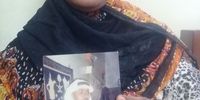 Rahma Ali holds a photo of her slain husband, Omar Faraj, taken on their wedding night. (Photo: Namir Shabibi)<br>