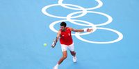 TOKYO, JAPAN - JULY 22: Novak Djokovic of Team Serbia plays a backhand shot during a practice match against Andy Murray of Team Great Britain ahead of the Tokyo 2020 Olympic Games at Ariake Tennis Park on July 22, 2021 in Tokyo, Japan. (Photo by Julian Finney/Getty Images)