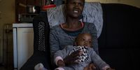 Julia Mogape holds her baby Gosiame at her home in Ikageng, Potchefstroom. Mogape felt sick after rain water flooded her house while she was pregnant. She was taken to hospital and placed in a Covid ward, despite been Covid negative according to Mogape. Her baby is named Gosiame, meaning ‘its alright’ after the ordeal.<br>Photo: Shiraaz Mohamed.
