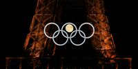 PARIS, FRANCE - JULY 22: The moon rises behind the Eiffel Tower and the Olympic Rings ahead of the Paris 2024 Olympic Games on July 22, 2024 in Paris, France. (Photo by Clive Rose/Getty Images)