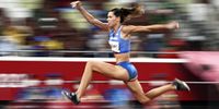 epa09385332 Hanna Minenko of Israel competes in the Women's triple jump final during the Athletics events of the Tokyo 2020 Olympic Games at the Olympic Stadium in Tokyo, Japan, 01 August 2021.  EPA-EFE/CHRISTIAN BRUNA