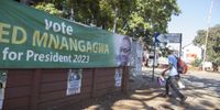 A man walks past an election banner of President Emmerson Mnangagwa in Harare, Zimbabwe, 29 May 2023. (Photo: EPA-EFE / Arron Ufumeli) 