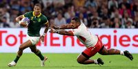 Manie Libbok of South Africa breaks with the ball while under pressure from Paula Ngauamo of Tonga during their Rugby World Cup France 2023 match at Stade Velodrome in Marseille on 1 October 2023. (Photo: Cameron Spencer / Getty Images)