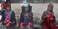 Buddhist women wait for the Dalai Lama's arrival at a monastery in Zanskar, Kargil district, in the Indian-administered Ladakh, 19 July 2025. The Tibetan Buddhist spiritual leader's visit to Zanskar has been postponed for a day due to bad weather conditions. The 14th Dalai Lama is on a month-long visit to the high-altitude desert Ladakh in the Himalayas.  EPA/FAROOQ KHAN