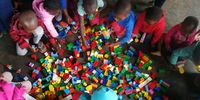 Children play with Lego at a creche at Tholokuhle – one of several local educational initiatives Tendele Mining has sponsored.