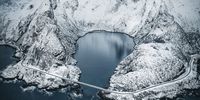 Fjord on the Edge. The Lofoten Islands are stunning and unique in winter: the freezing cold sea, steep mountains and colourful houses combine to make an absolutely breathtaking adventure. © Marc Hennige, Germany, Shortlist, Professional, Landscape, 2021 Sony World Photography Awards