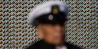 WASHINGTON, DC - NOVEMBER 11: Stars on the Freedom Wall are seen behind World War II Navy veteran Senior Chief Petty Officer Remigio Cabacar during a Veterans Day ceremony at the World War II Memorial on November 11, 2021 in Washington, DC. The ceremony, organized by the National Park Service and Friends of the World War II Memorial, honors the 16 million American men and women who served in World War II. (Photo by Drew Angerer/Getty Images)