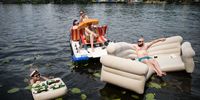 BERLIN, GERMANY - JUNE 19: A man sunbathes in an inflatable boat shaped like a sofa on Spree river near Treptower Park on June 19, 2021 in Berlin, Germany. Temperatures are reaching 36 degrees Celsius across large parts of Germany over the weekend. (Photo by Steffi Loos/Getty Images)