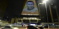 Cars pass a building where an image of football icon 'Pele' is displayed after he passed away on 29 December, 2022 in Sao Paulo, Brazil. (Photo: Mauro Horita/Getty Images