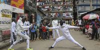 Kenyan professional fencer Isaac Mburu Wanyoike (L) trains with teenage members of the Tsavora Fencing Mtaani club in the streets of the Huruma slum in Mathare, Nairobi, Kenya, 17 April 2024 (issued 24 April 2024). The Tsavora Fencing Mtaani club was founded by Isaac Mburu Wanyoike, a gang member turned pro-fencer, the first Kenyan to represent the country in international fencing competitions, and the current coach for Kenya’s Fencing team. "I wanted to change to be an example in the community, a positive figure", Mburu said. Mburu is bringing a new hope to Kenyan youths in the Huruma slum by engaging them in fencing, using the streets as their arena as they parry and riposte in front of curious onlookers. They also go to Nairobi’s central business district to show-fence to members of the public as a way to raise funds that support them in acquiring training kits and building a dedicated facility. Tsavora depends in part on the will of the people, although much of its budget comes from fee-paying international school programs and private classes. More than a hobby for the young athletes, fencing has helped them carve a path away from crime, drug abuse, teenage pregnancies and other social pressures. Today the club has 45 students and has become a reference for the suburb of Mathare, the second largest suburb of Nairobi. Mburu will travel to Algeria to take part in the Zonal Qualifying Tournament for the 2024 Paris Olympics qualifiers.  EPA-EFE/Daniel Irungu  ATTENTION: This Image is part of a PHOTO SET