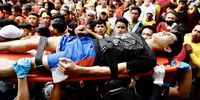 Rescuers carry an injured Catholic devotee during the procession marking the feast day of the Black Nazarene at the old district of Quiapo in Manila, Philippines, 09 January 2024. The Black Nazarene feast day honoring Jesus Christ is one of the first major celebrations for Catholics at the start of every year, and is highlighted by a whole day procession of barefoot devotees.  EPA-EFE/FRANCIS R. MALASIG