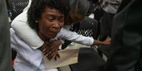 Relatives and agents bid farewell to three of the fourteen police officers killed in the last two weeks by armed gangs at their funeral in Port-au-Prince, Haiti 31 January 2023.  EPA-EFE/Johnson Sabin
