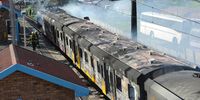  The City's Fire and Rescue Service respond to a train that was set alight at Steenberg Railway Station on June 18, 2018 in Cape Town, South Africa. No injuries have been reported and the cause of the fire is unknown. (Photo by Gallo Images/Brenton Geach).