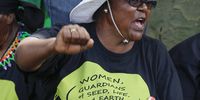 A supporter of the Rural Womens Assembly chants during a protest at speakers corner outside the COP 17 / CMP 7 United Nations (UN) Climate Change Conference 2011 in Durban, South Africa 05 December 2011. The 17th session of the Congress of the Parties (COP) comprising 194 countries meeting to discuss the United Nations Framework Convention on Climate Change (UNFCCC) heads into its high level phase for the final week of negotiations.  EPA/NIC BOTHMA