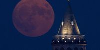 ISTANBUL, TURKEY - AUGUST 30: A rare Super Blue Moon rises over Istanbul's famous Galata Tower on August 30, 2023 in Istanbul, Turkey. The rare super moon is an occurrence which won't happen again until 2037, the term "Blue Moon" does not refer to the color of the moon, but is the term used to signify the second full moon in a month.  (Photo by Chris McGrath/Getty Images)