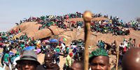 People gather in Marikana to observe the sixth anniversary of the Marikana massacre on August 16, 2018 in Rustenburg, South Africa. On August 16, 2012, 34 miners were gunned down by police in the middle of a protracted wage strike by workers of Lonmin mine. Speaking during the event, AMCU president Joseph Mathunjwa decribed the massacre as crime against humanity.  (Photo by Gallo Image / Sowetan / Thulani Mbele)