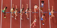TOKYO, JAPAN - JULY 31: Runners pass their batons in the 4x400m Relay Mixed Final on day eight of the Tokyo 2020 Olympic Games at Olympic Stadium on July 31, 2021 in Tokyo, Japan. (Photo by Richard Heathcote/Getty Images)