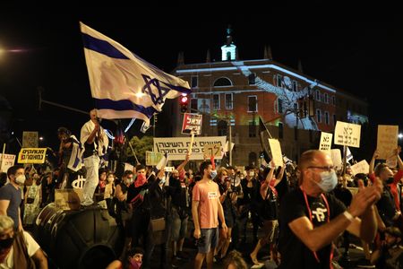 Israelis protest outside Netanyahu's home after bid to curb demonstrations