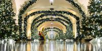 Holiday decorations adorn the Center Hall of the White House in Washington, DC, USA, 02 December 2024. US First Lady Jill Biden announced the 2024 White House Holiday theme as a 'Season of Peace and Light'. The displays include 83 Christmas trees, 9,810 feet of ribbon, 28,125 ornaments, and 165,075 holiday lights to decorate the trees, garlands, and wreaths.  EPA-EFE/JIM LO SCALZO