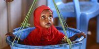 A baby of an internally displaced woman gets weighed during a doctor and nutritionist review to prevent malnutrition at a makeshift clinic in Ladan IDP camp, on the outskirts of Dollow, in Jubaland state, Somalia, 30 January 2024 (issued 20 March 2024). More than three decades of conflict have left the country without a functional health system, while the jihadist group Al Shabab, which controls most of the centre and south of the country, does not allow immunization in its territory in most cases. Furthermore, Somalia has 3.8 million displaced people, and more than a quarter of its population participates somehow in nomadic pastoralism, which makes vaccination even harder. To overcome these challenges, medical personnel travel across the country in mobile teams to reach the most remote places.  EPA-EFE/DANIEL IRUNGU